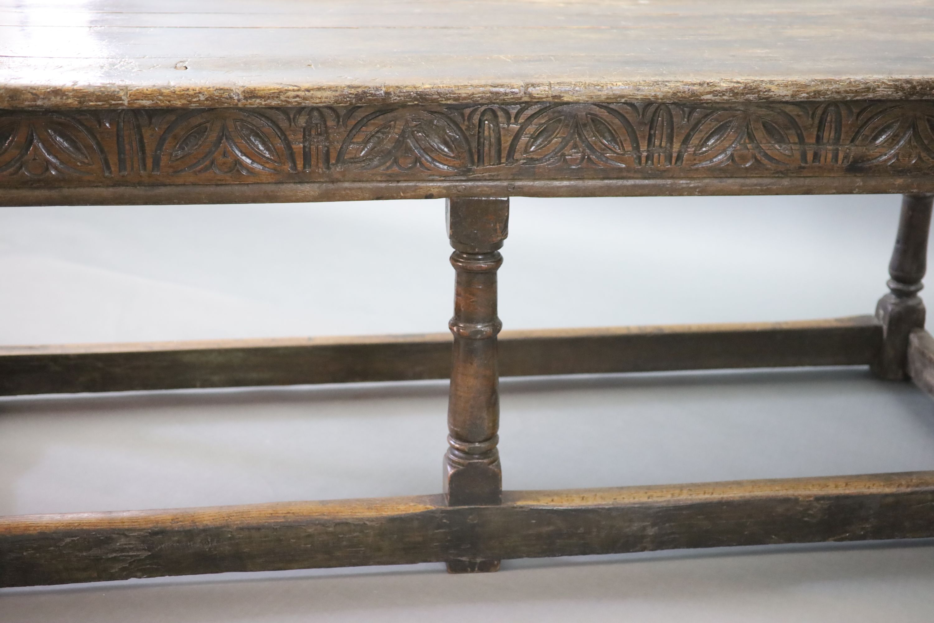 A 17th century oak and elm refectory table, L.255cm W.82cm H.78cm